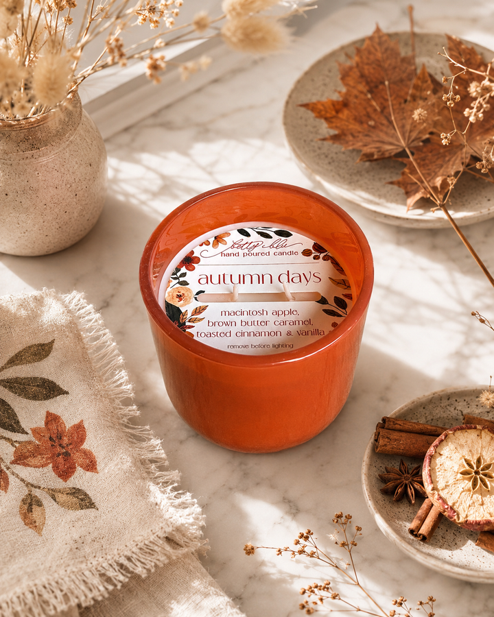 The Autumn Gift Set by Betty Blu, orange tin candle beside a wax melt tin