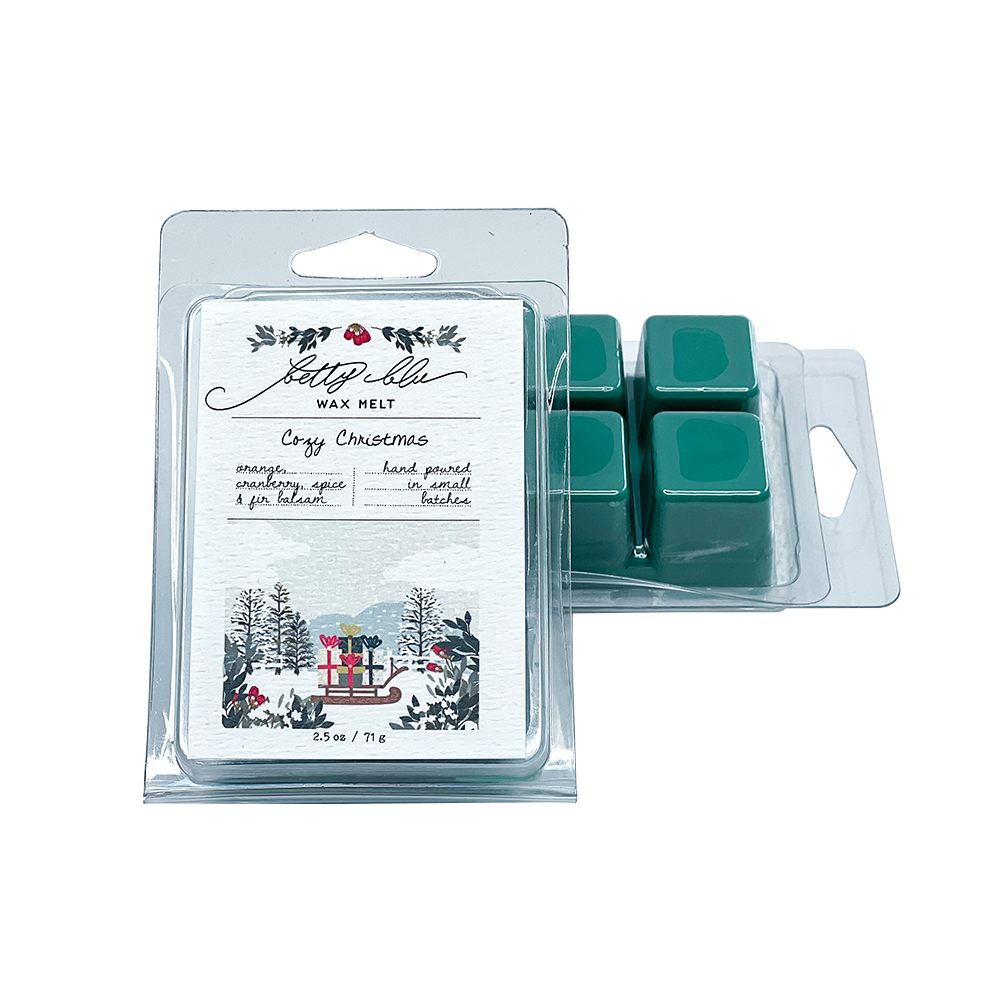 Cozy Christmas Wax Melts in red and green clamshell packaging