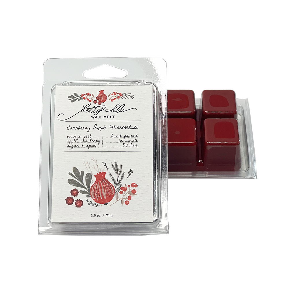 Cranberry Apple Marmalade wax melts in clear clamshell with cheerful artwork.