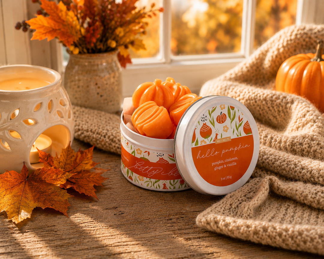 The Orchard Walk, Fall Wax Melt Gift Set by Betty Blu, open tin of orange melts with a candle