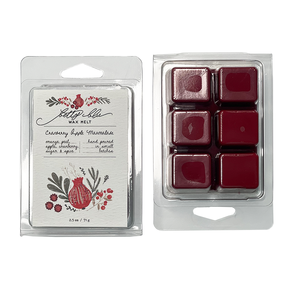 Cranberry wax melt cubes displayed with holiday fruit themed label.