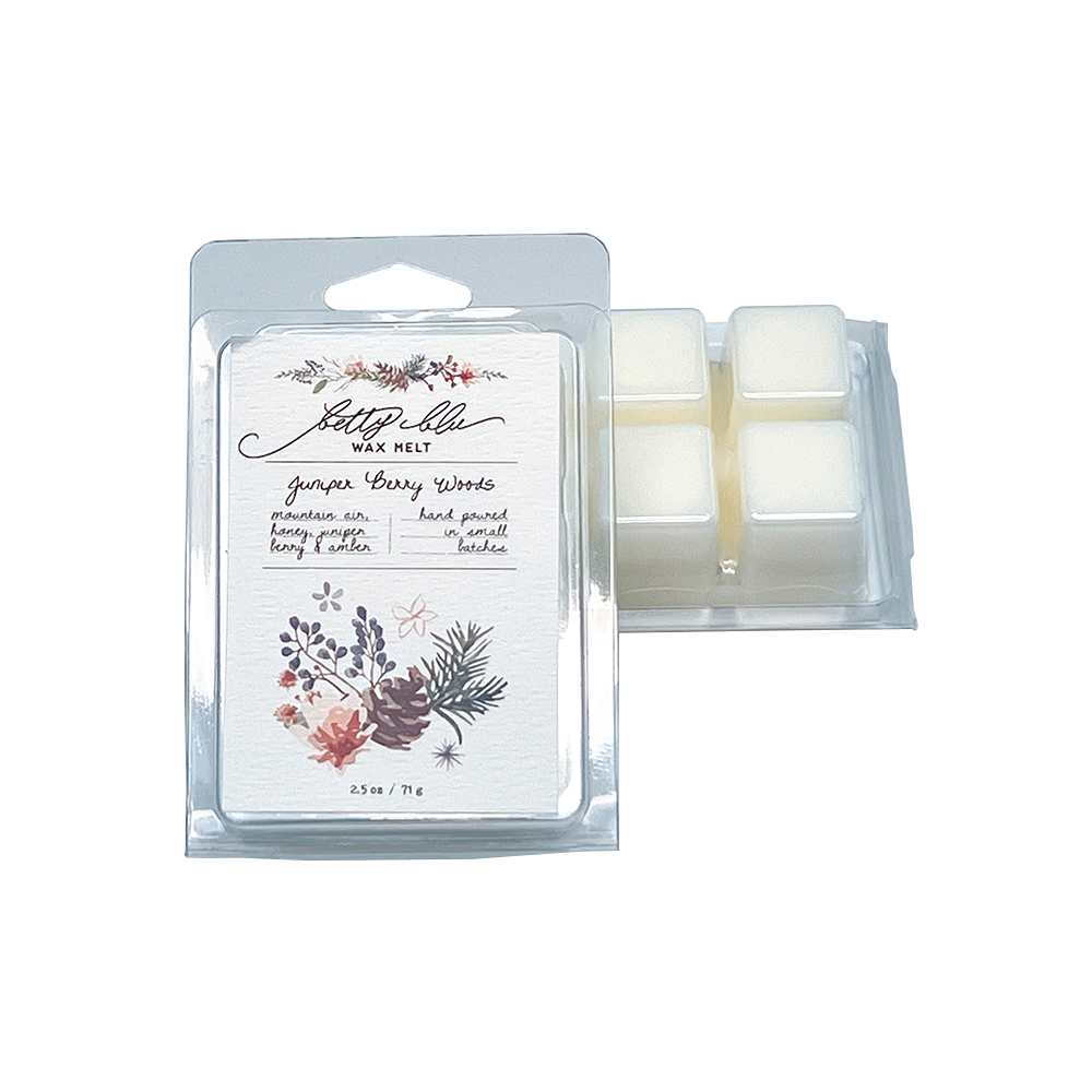 Juniper Berry Woods wax melt clamshell with pine and berry artwork.