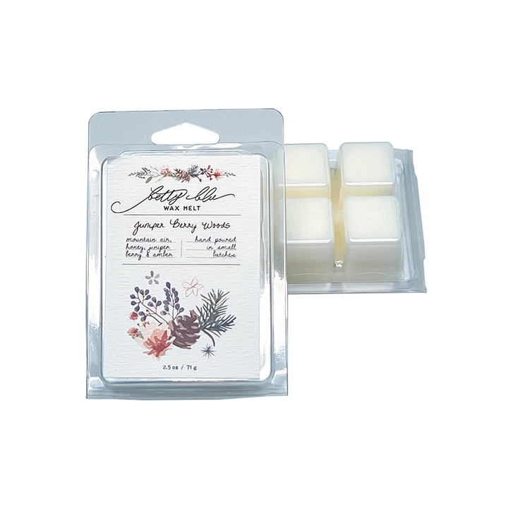Juniper Berry Woods wax melt clamshell with pine and berry artwork.