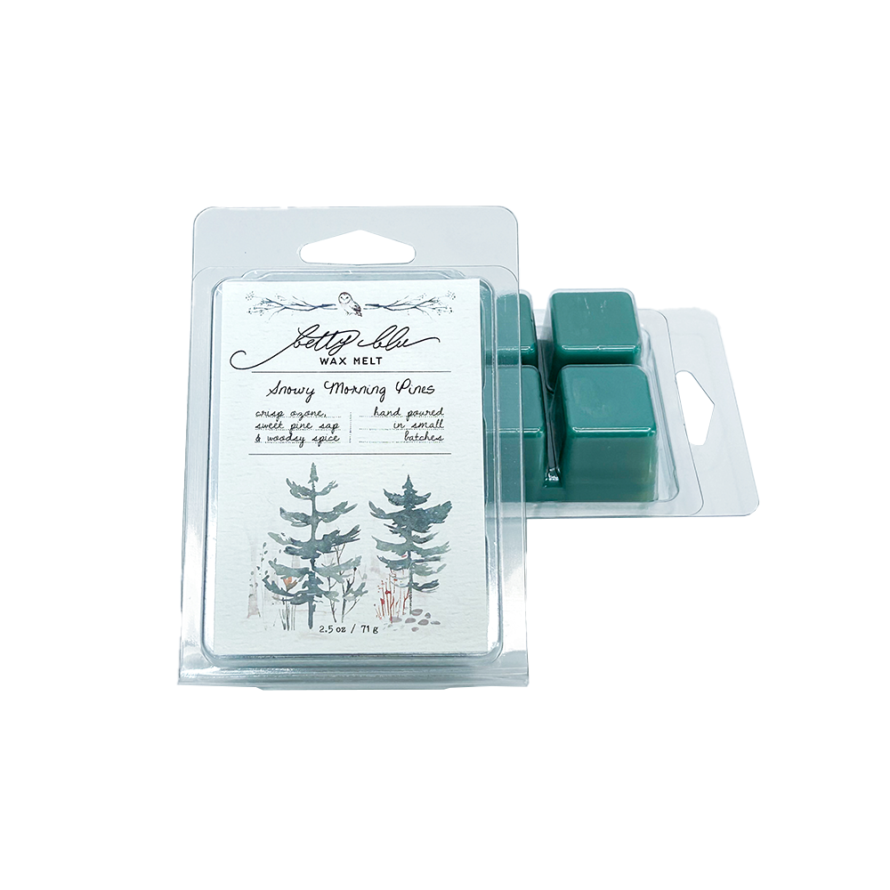 Green pine scented wax melts in clear clamshell packaging.